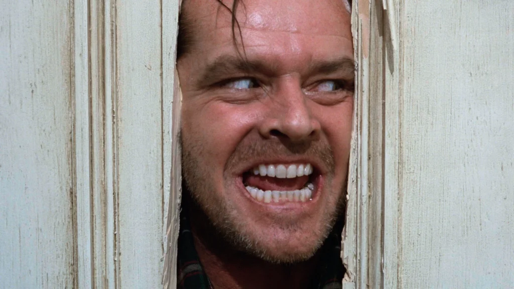 The 10 Greatest Horror Thriller Films Ever Made . A scene from the 1980 Movie The Shining .Image Credit: © TMDb (www.themoviedb.org) – Used for informational/review purposes only.