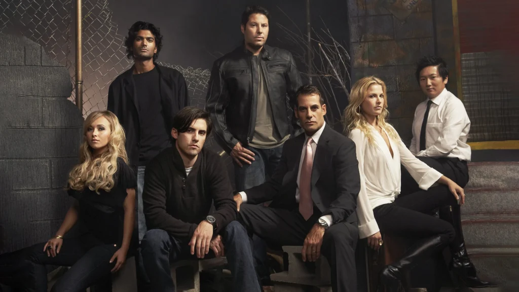 An image dfrom the series Heroes.showing all the leading characters in image.Image Credit: © TMDb (www.themoviedb.org) – Used for informational/review purposes only.