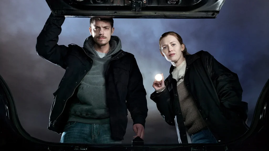 A scene from the series the killing.Image Credit: © TMDb (www.themoviedb.org) – Used for informational/review purposes only.